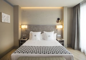Premium bedding, down comforters, pillowtop beds, minibar
