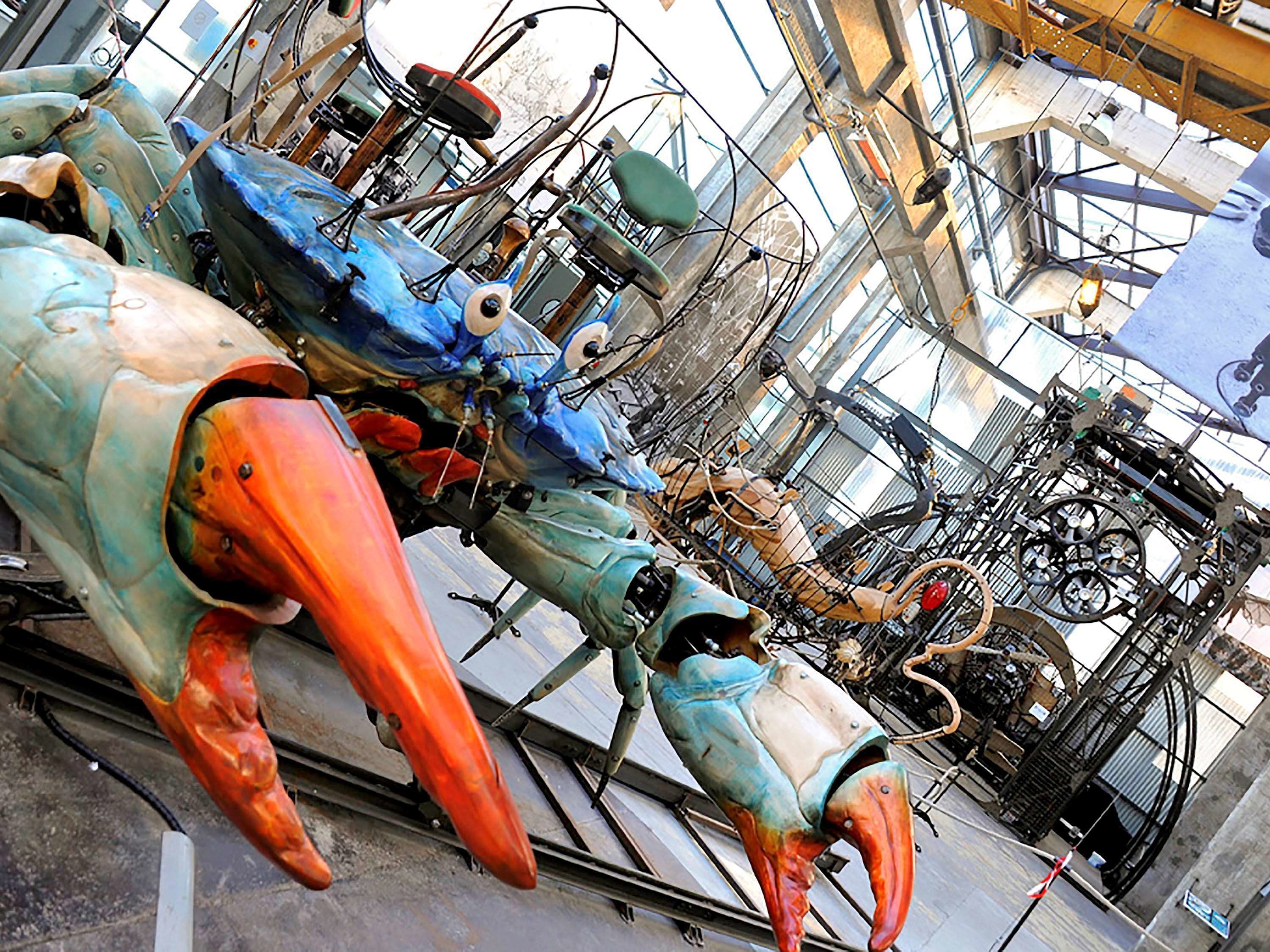 A large mechanical structure with various gears and components, likely part of an industrial or engineering exhibit.