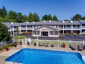 Seasonal outdoor pool, open 8:30 AM to 8:00 PM, pool loungers