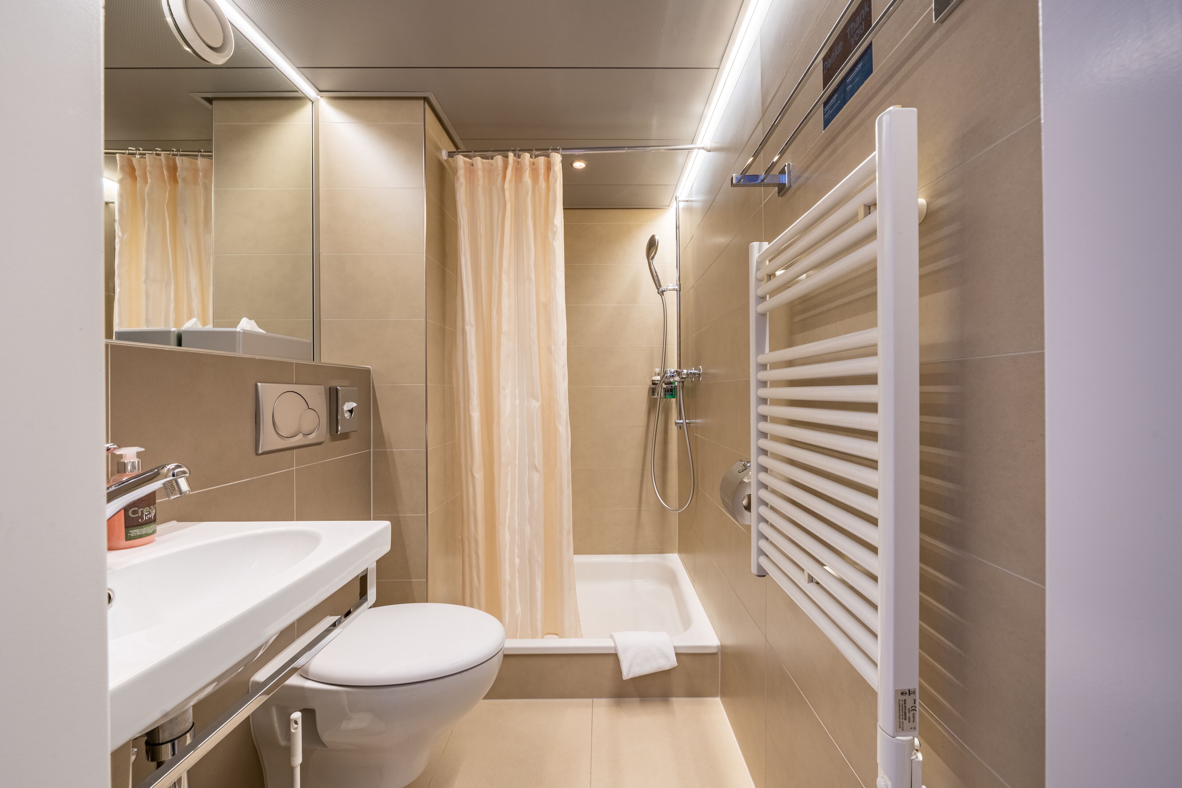 small double queen room | bathroom | eco-friendly toiletries, hair dryer, towels, soap