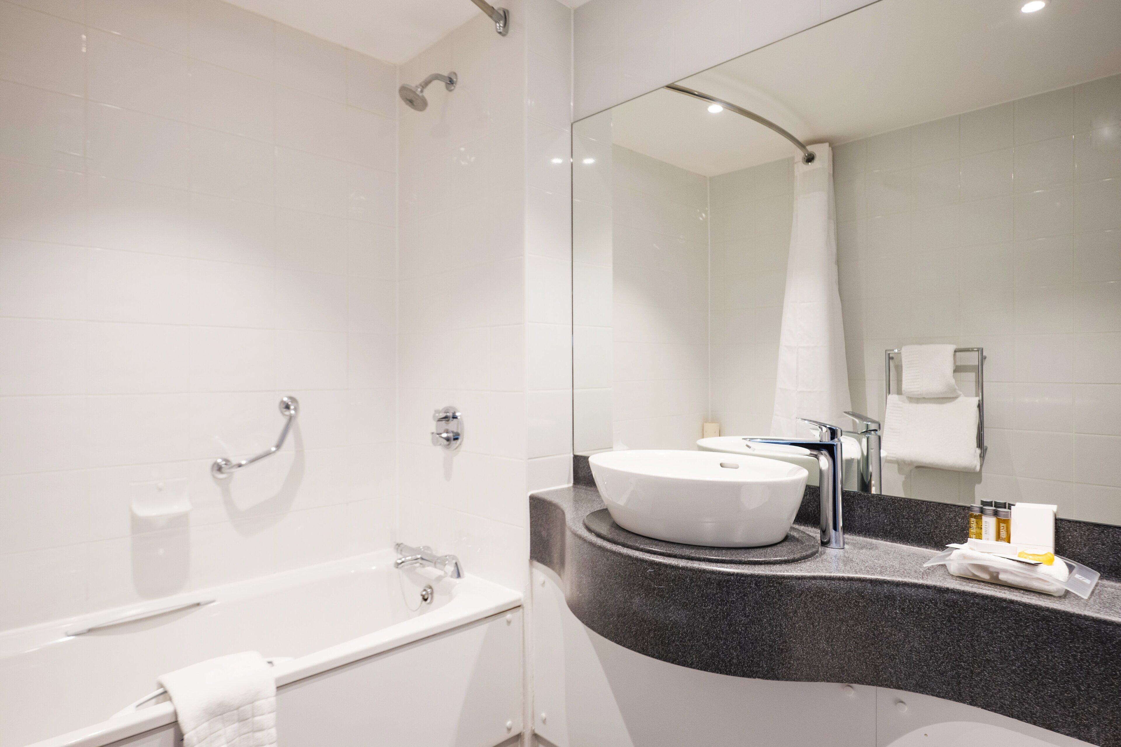 eco-friendly toiletries, hair dryer, towels