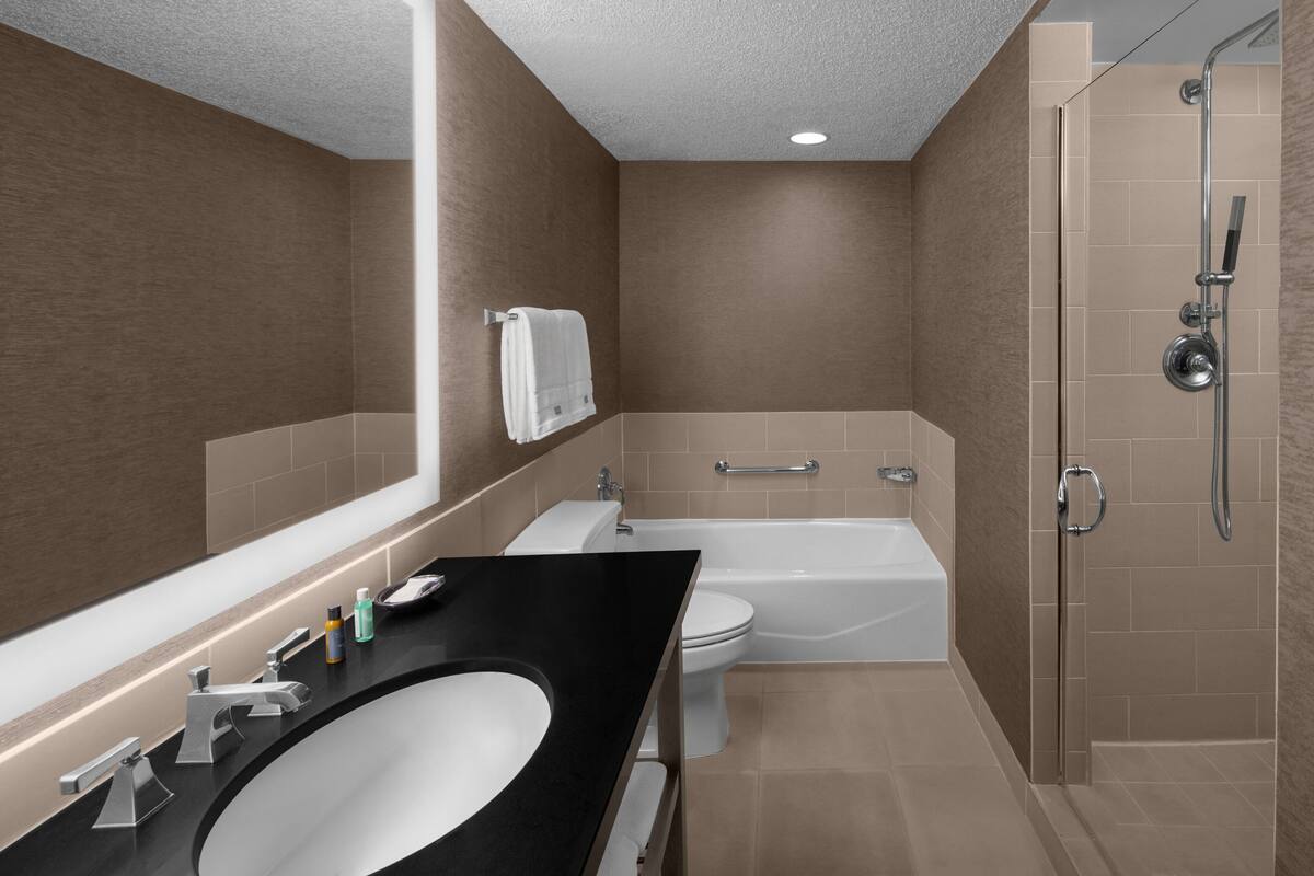 executive suite, 1 king bed with sofa bed, non smoking | bathroom | shower, free toiletries, hair dryer, towels