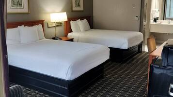 Premium bedding, desk, laptop workspace, blackout drapes