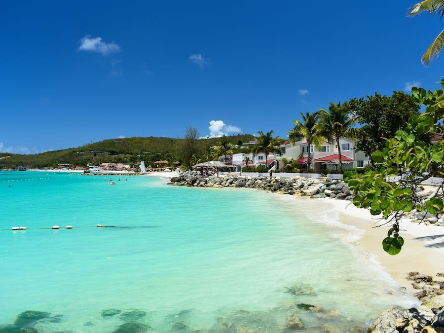 On the beach, white sand, sun-loungers, beach umbrellas