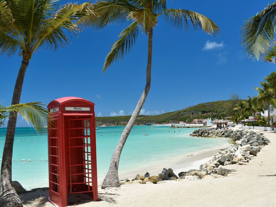 On the beach, white sand, sun loungers, beach umbrellas