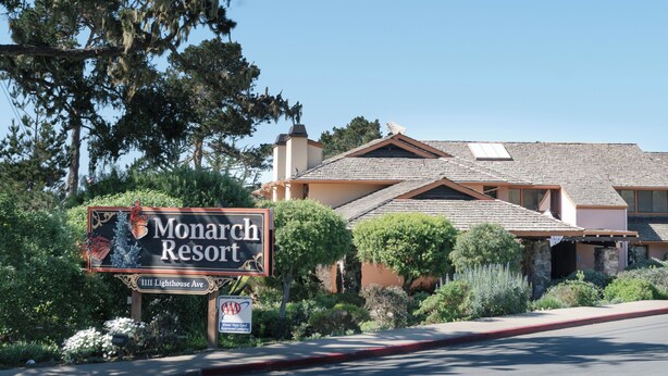 A sign for Monarch Resort at 1111 Lighthouse Ave. - Monarch Resort (Pacific Grove)