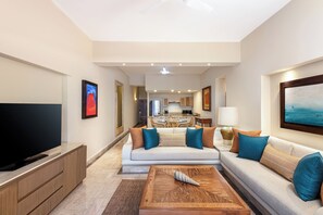 Deluxe Suite, 1 Bedroom | Living area | 42-inch plasma TV with cable channels