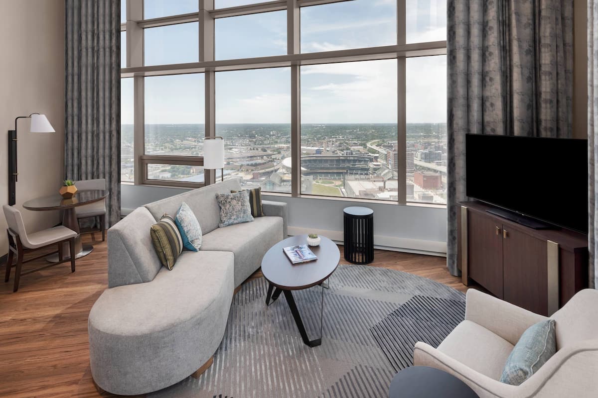 Premium bedding, desk, laptop workspace, blackout drapes