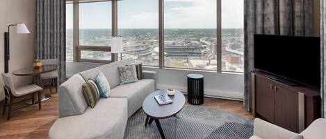 Premium bedding, desk, laptop workspace, blackout drapes