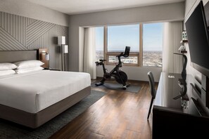 Premium bedding, desk, laptop workspace, blackout curtains