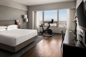 Premium bedding, desk, laptop workspace, blackout drapes