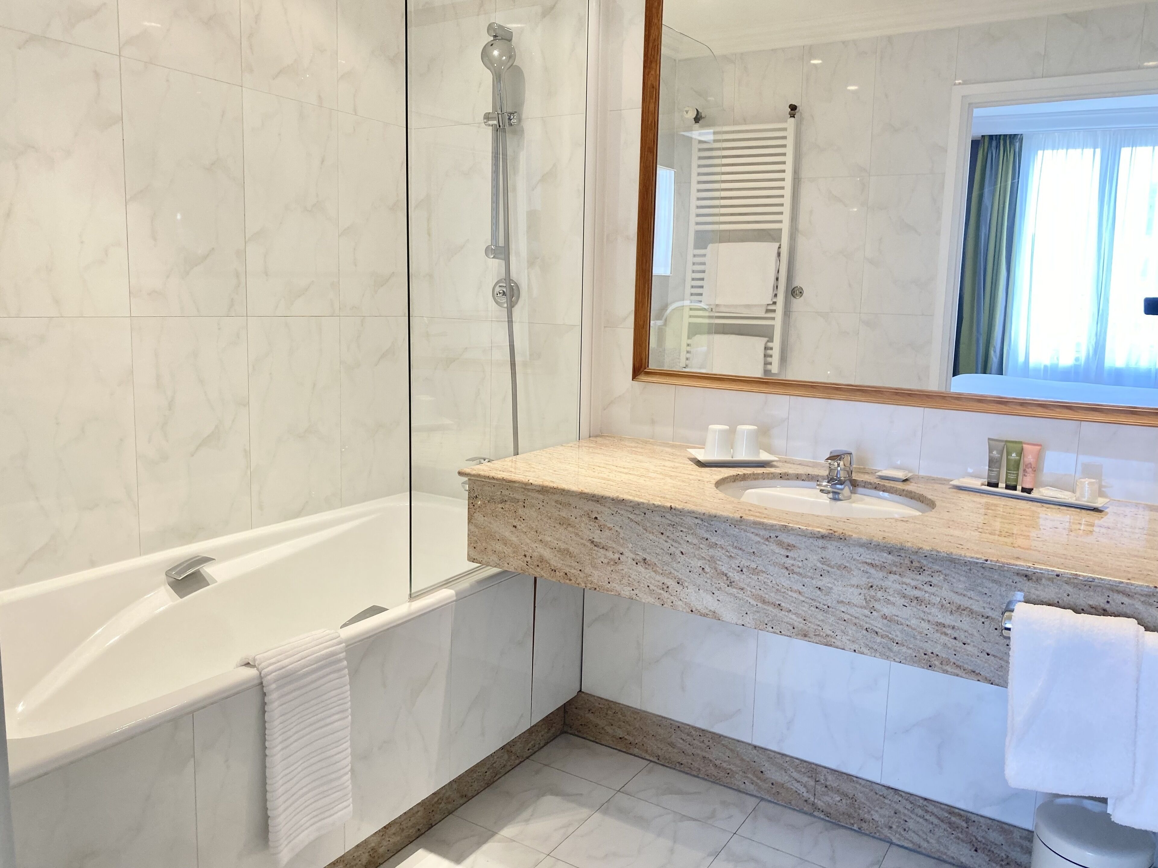 executive double or twin room | bathroom | combined shower/bathtub, eco-friendly toiletries, hair dryer, bathrobes