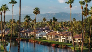 A resort with multiple-story buildings, a swimming pool, and palm trees. - Omni Rancho Las Palmas Resort & Spa (Rancho Mirage)