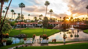 A resort with a pool, palm trees, and a sunset. - Omni Rancho Las Palmas Resort & Spa (Rancho Mirage)