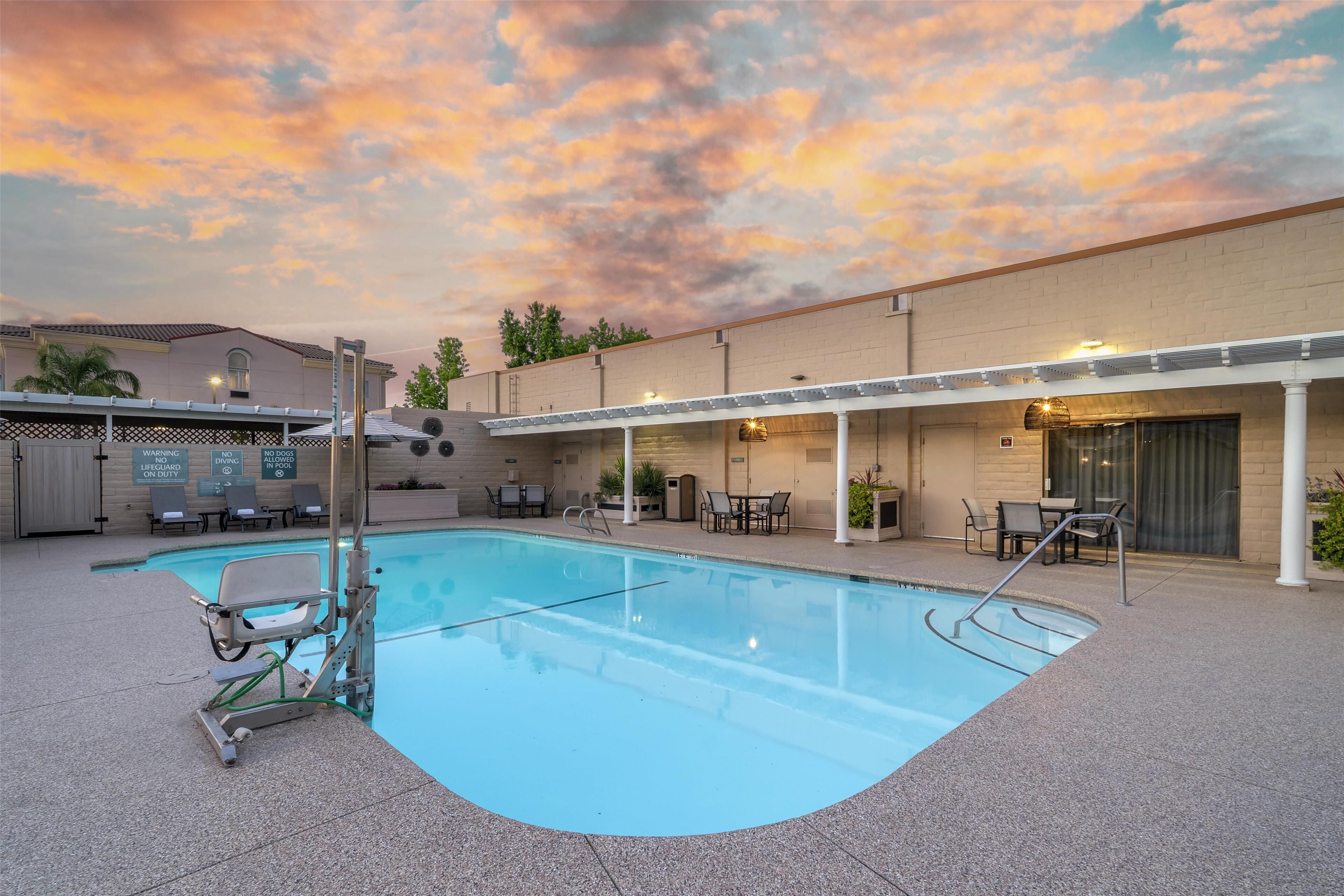 outdoor pool, open 8:00 am to 10:00 pm, pool umbrellas, pool loungers