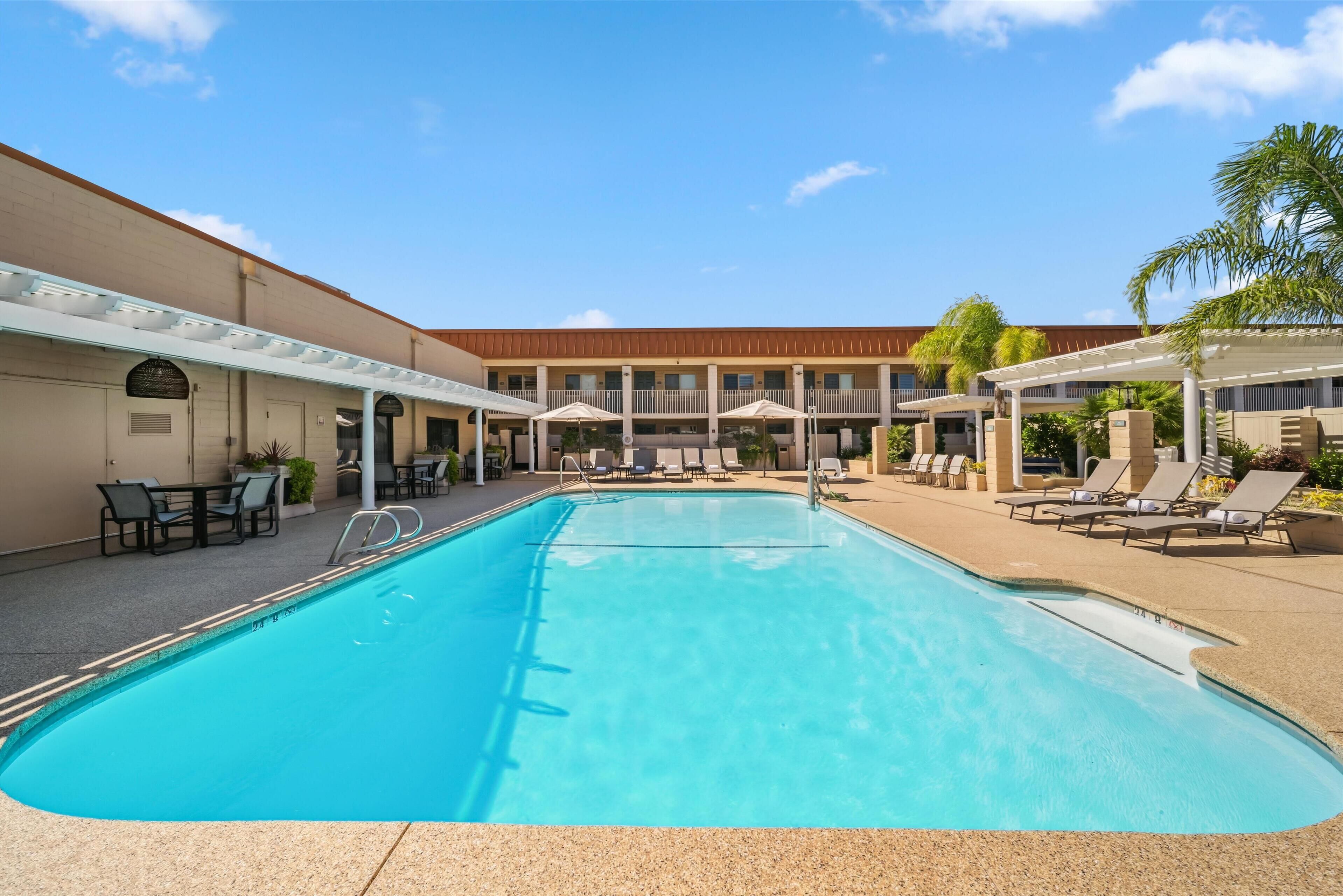 outdoor pool, open 8:00 am to 10:00 pm, pool umbrellas, pool loungers