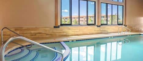 Indoor pool, open 8:00 AM to 11 PM, pool loungers