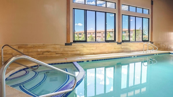 Indoor pool, open 8:00 AM to 11 PM, pool loungers