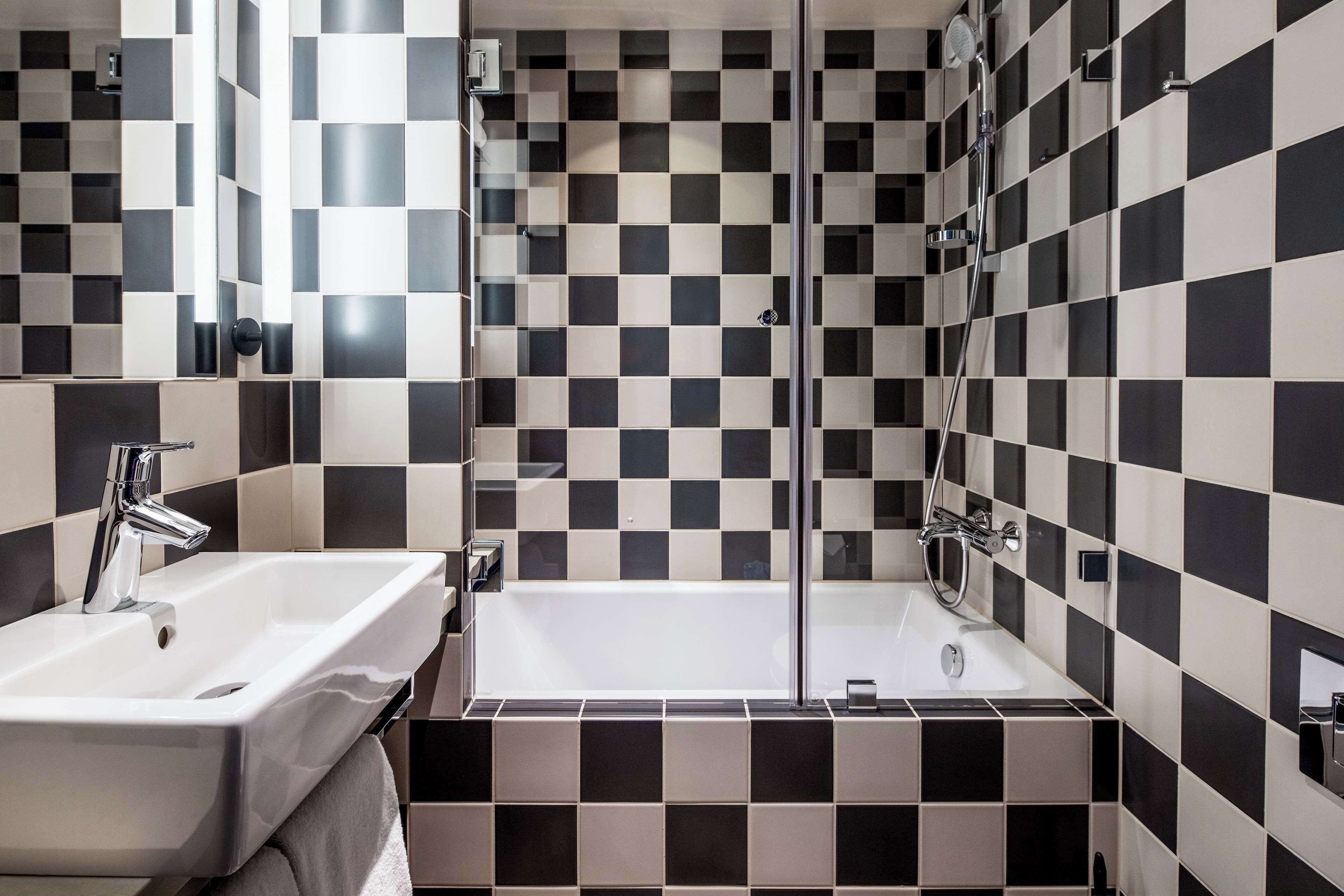 family room, 1 king bed with sofa bed (standard - three) | bathroom | eco-friendly toiletries, hair dryer, towels