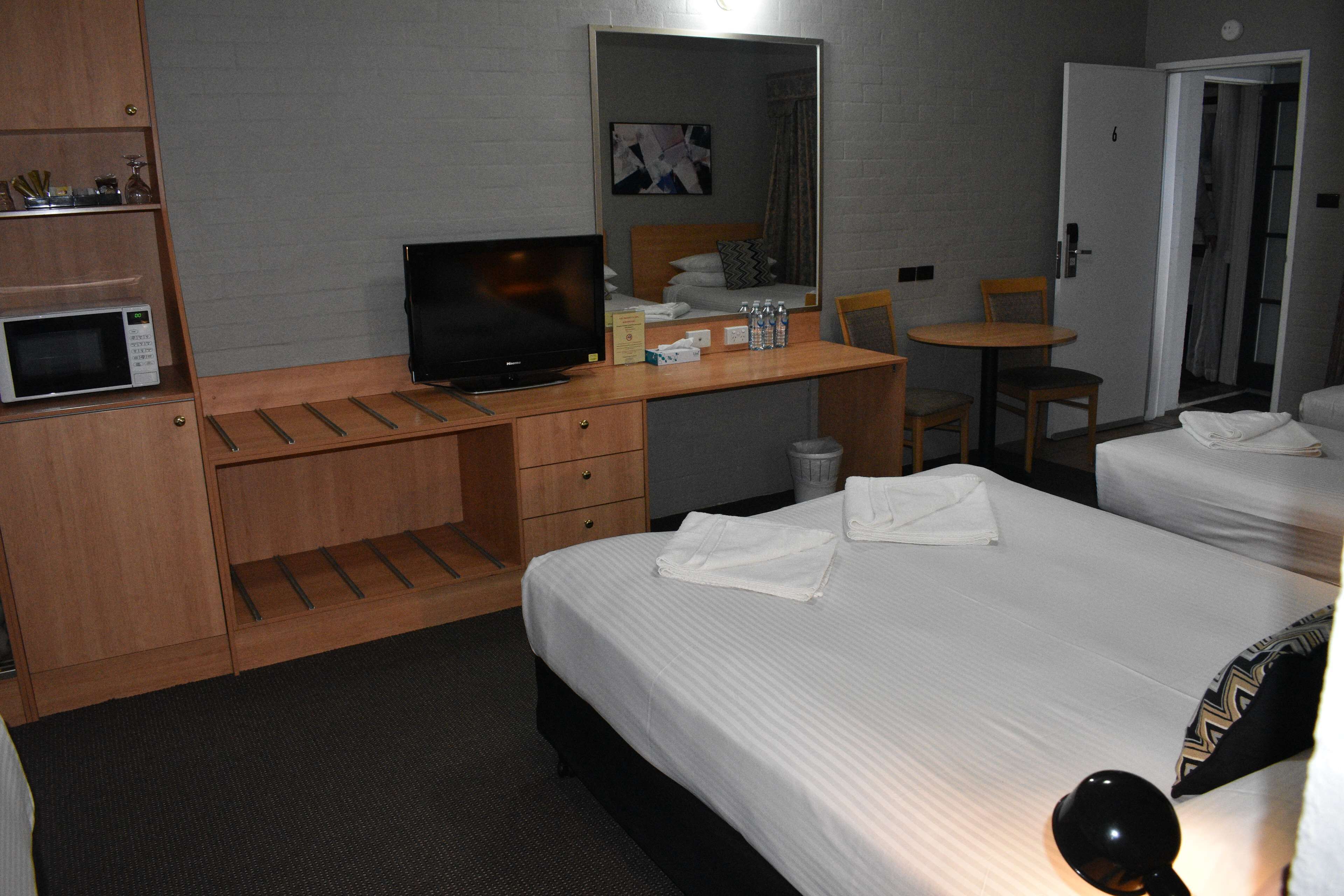 deluxe room, multiple beds, non smoking | blackout curtains, soundproofing, iron/ironing board, free wifi