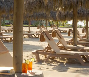 On the beach, sun-loungers, beach umbrellas, beach towels
