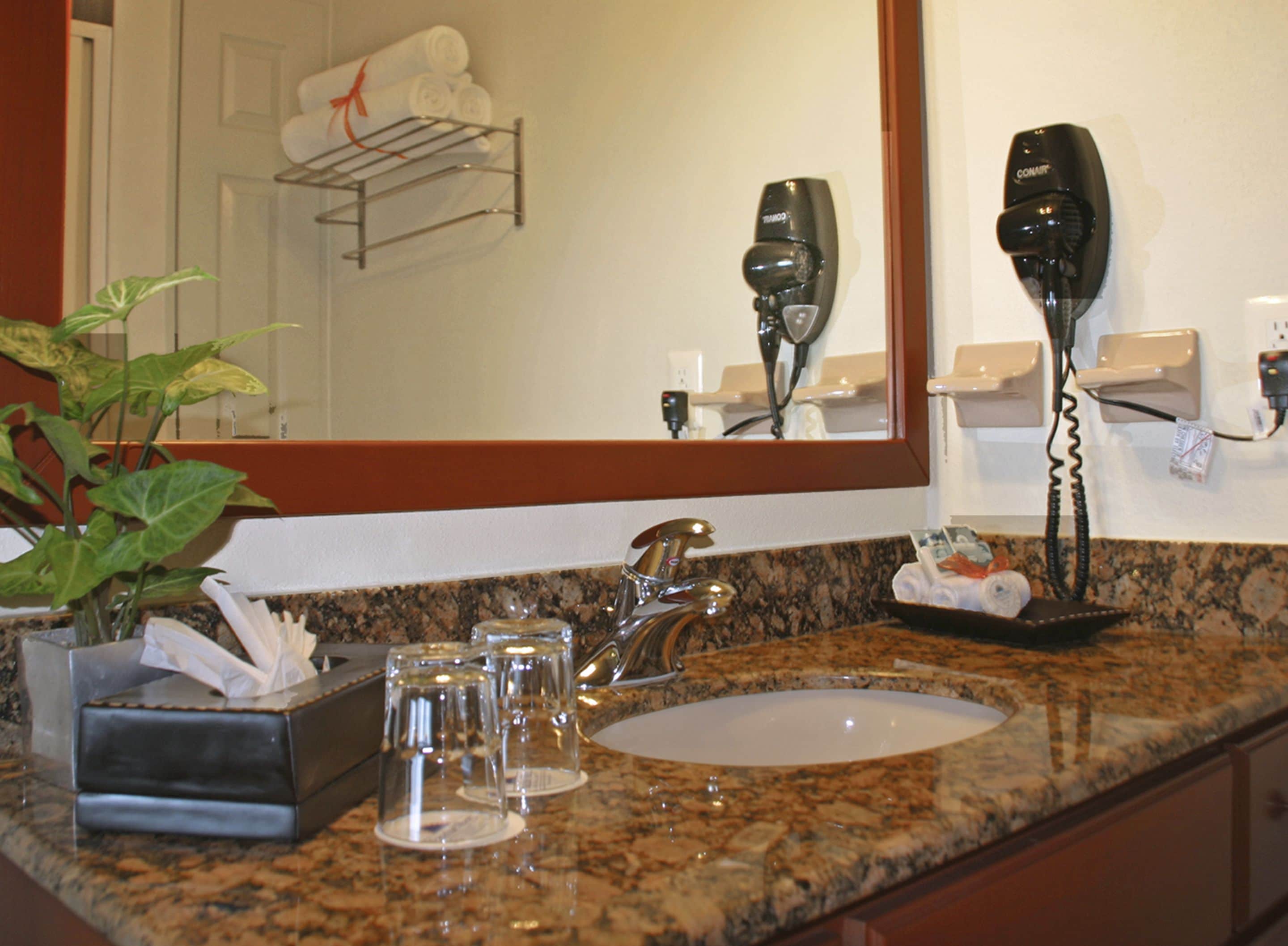 eco-friendly toiletries, hair dryer, towels