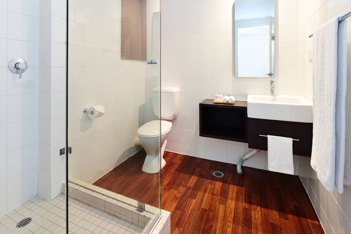 designer toiletries, hair dryer, bathrobes, slippers