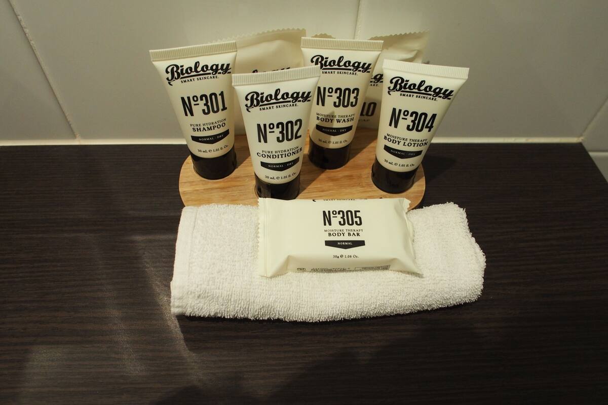 designer toiletries, hair dryer, bathrobes, slippers