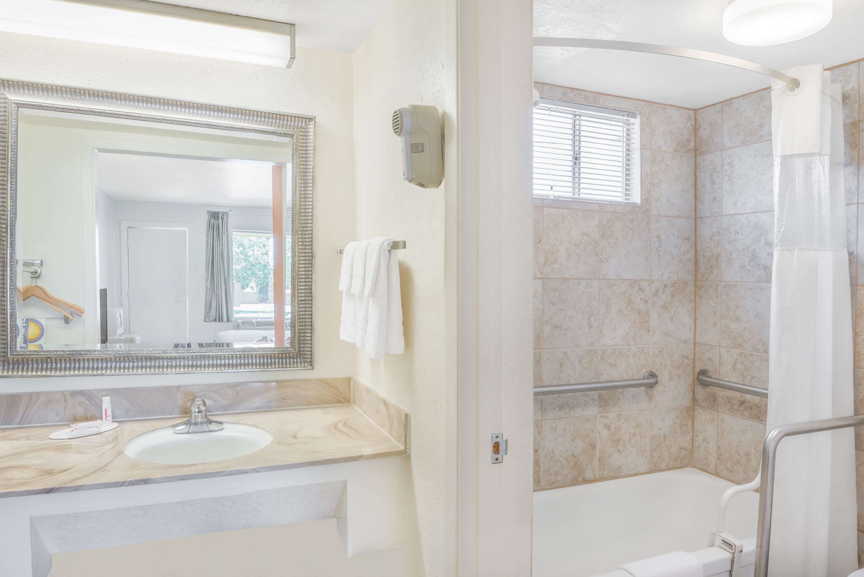 eco-friendly toiletries, hair dryer, towels