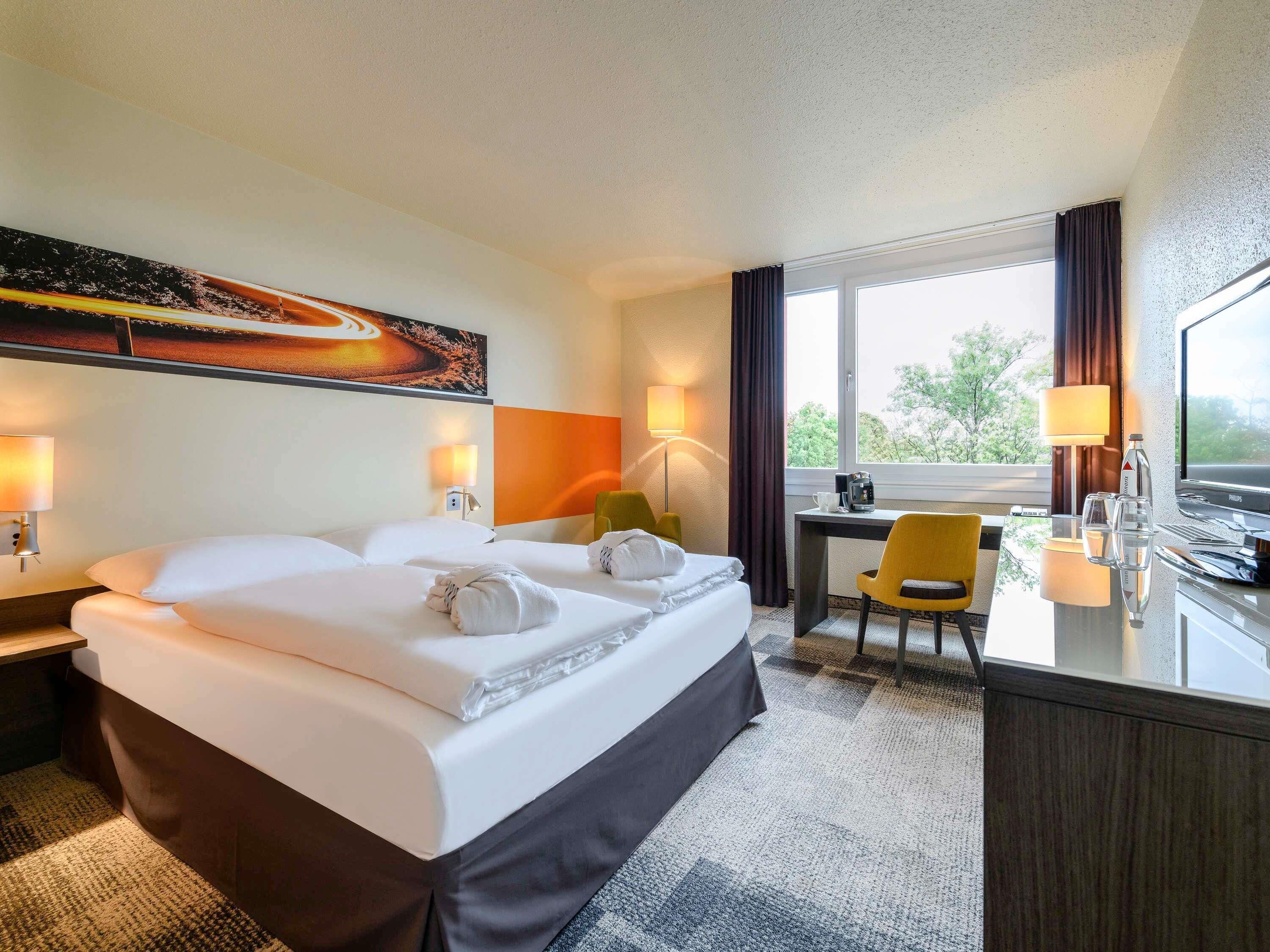Premium bedding, down comforters, in-room safe, desk
