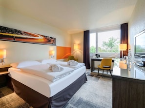 Premium bedding, down duvets, in-room safe, desk