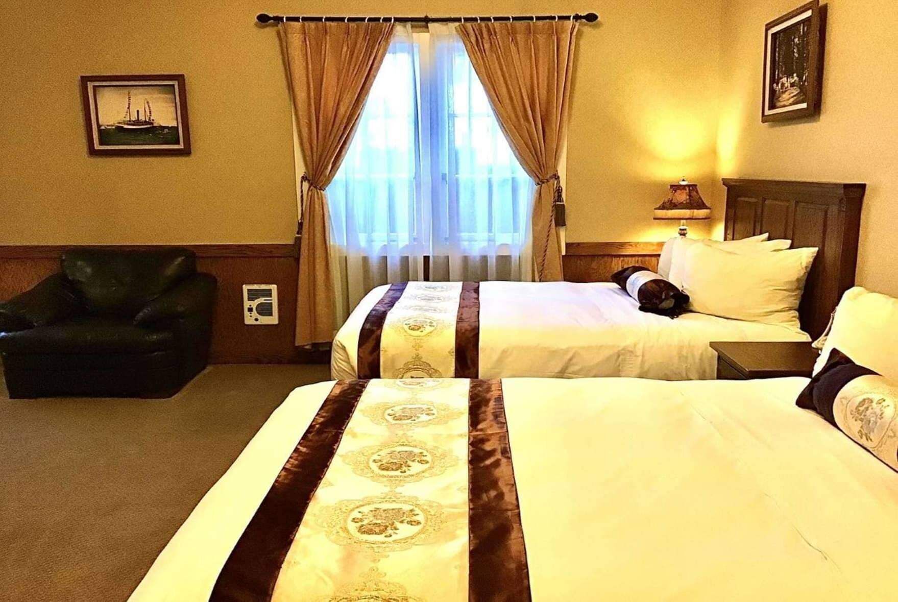 Desk, iron/ironing board, bed sheets