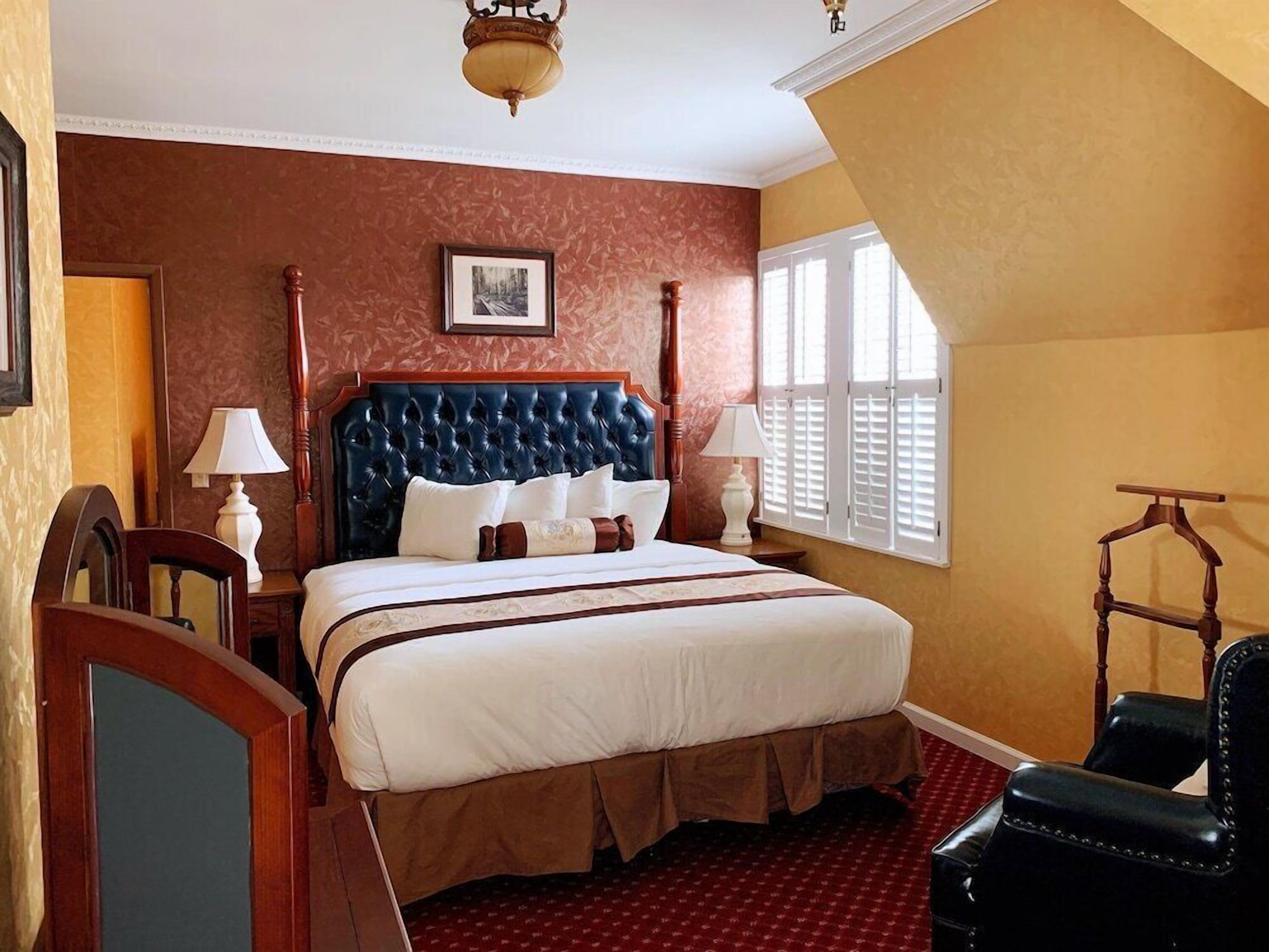 Desk, iron/ironing board, bed sheets