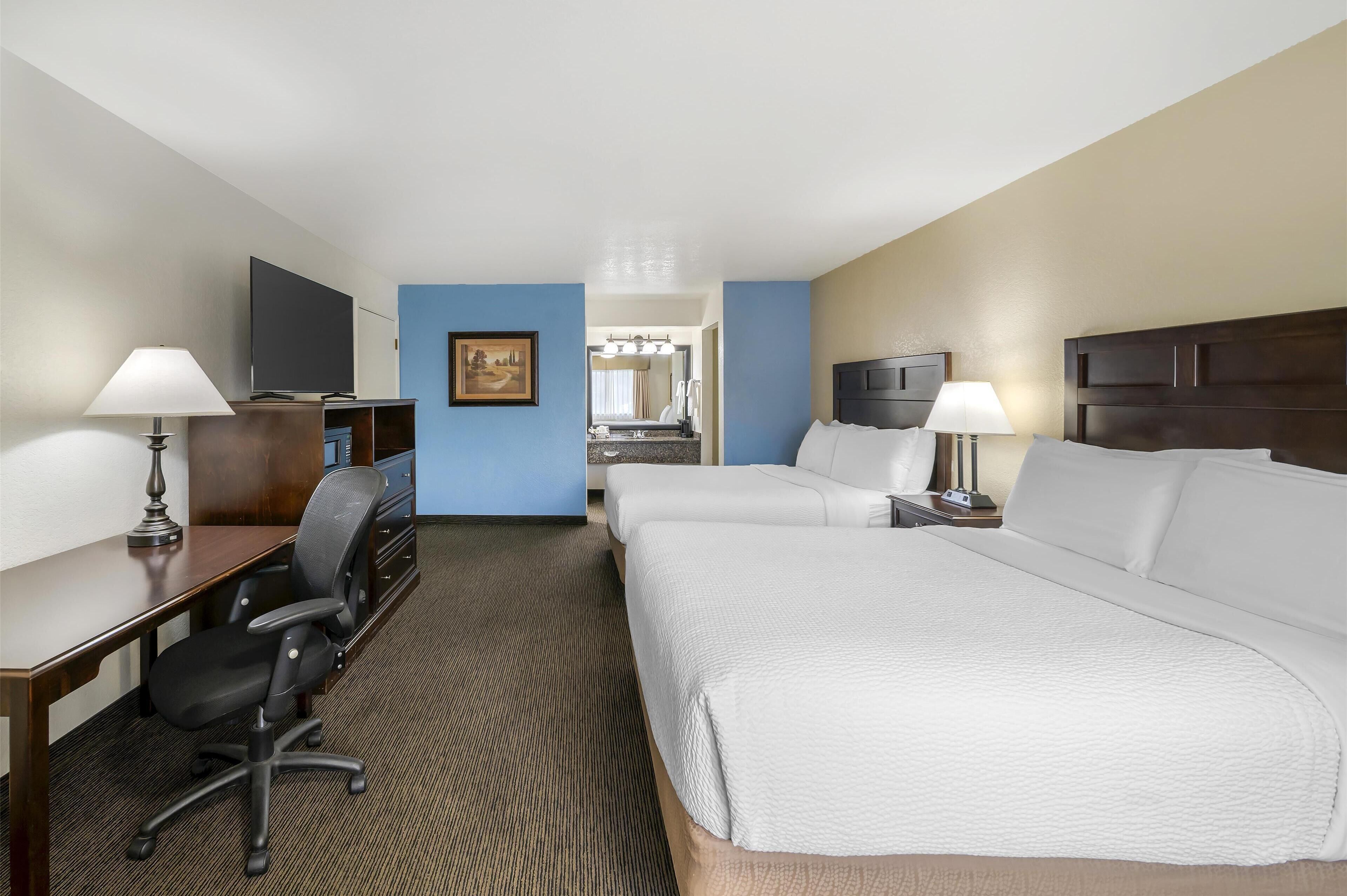 standard room, 2 queen beds, non smoking, refrigerator & microwave | pillow-top beds, iron/ironing board, rollaway beds, wifi