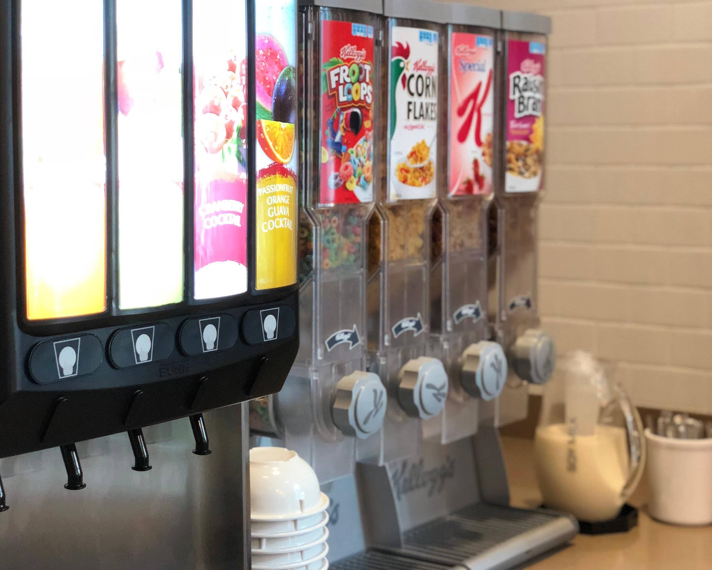 A beverage dispenser with multiple options including fruit loops, corn flakes, and special flavors.