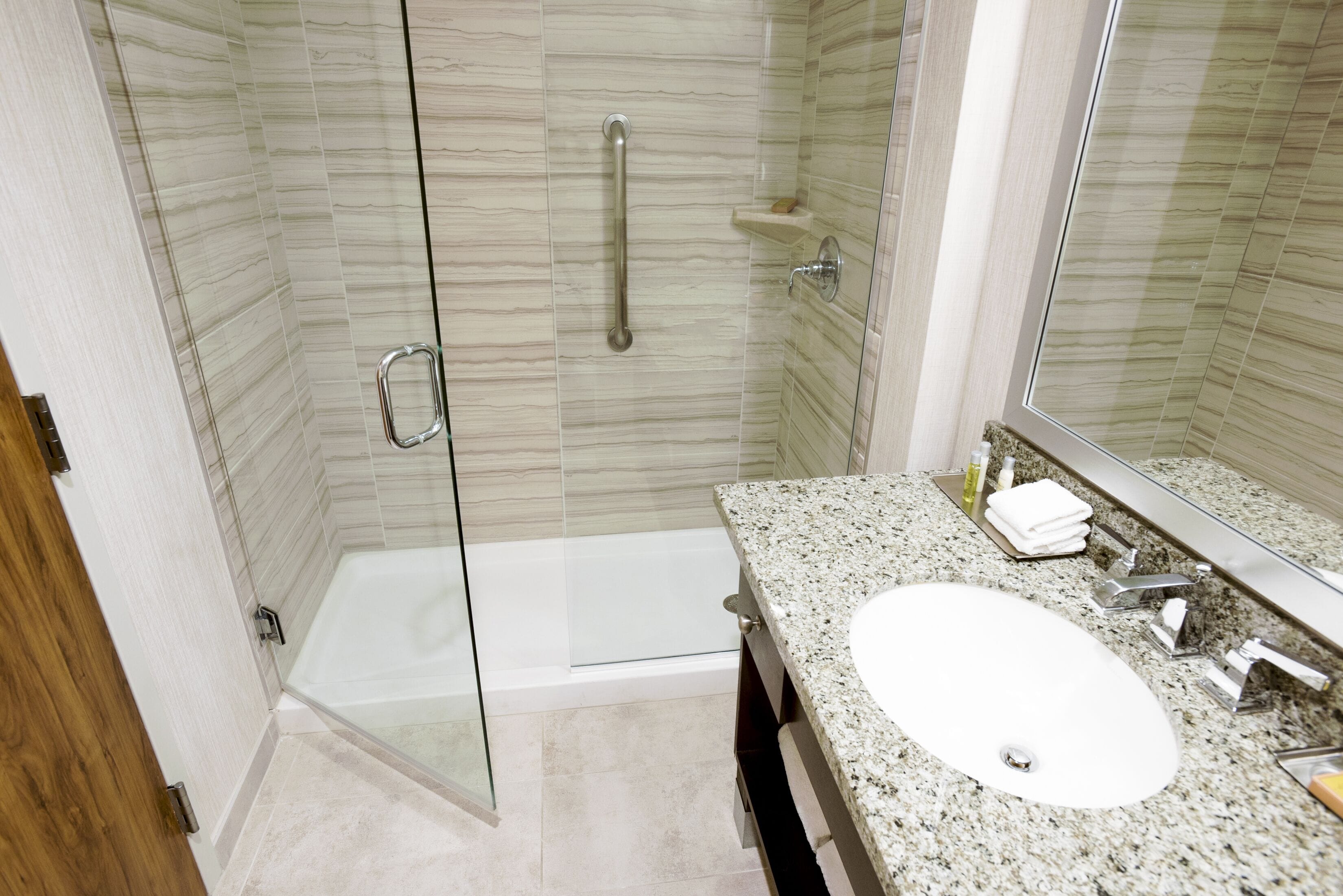 standard room, 1 king bed | bathroom | shower, eco-friendly toiletries, hair dryer, towels