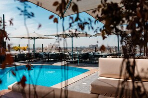 Outdoor pool, open 9:00 AM to 5:00 PM, pool umbrellas, pool loungers