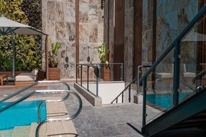 Outdoor pool, open 9:00 AM to 5:00 PM, pool umbrellas, pool loungers