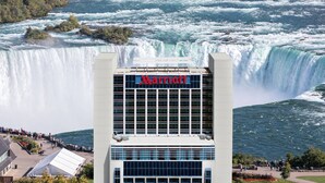 A Marriott hotel with a view of a large waterfall. - Niagara Falls Marriott on the Falls (Niagara Falls)
