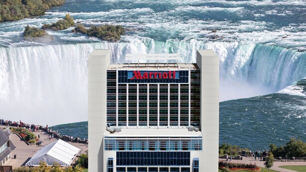 A Marriott hotel with a view of a large waterfall. - Niagara Falls Marriott on the Falls (Niagara Falls)