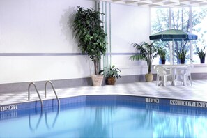 Indoor pool, open 6:00 AM to 11:00 PM, pool umbrellas