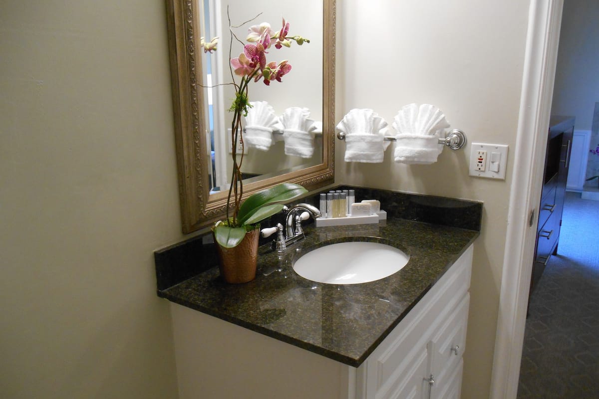 deluxe room, 1 king bed | bathroom sink