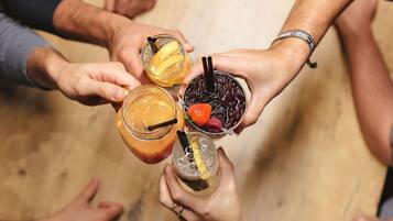 A group of people holding glasses of various beverages.