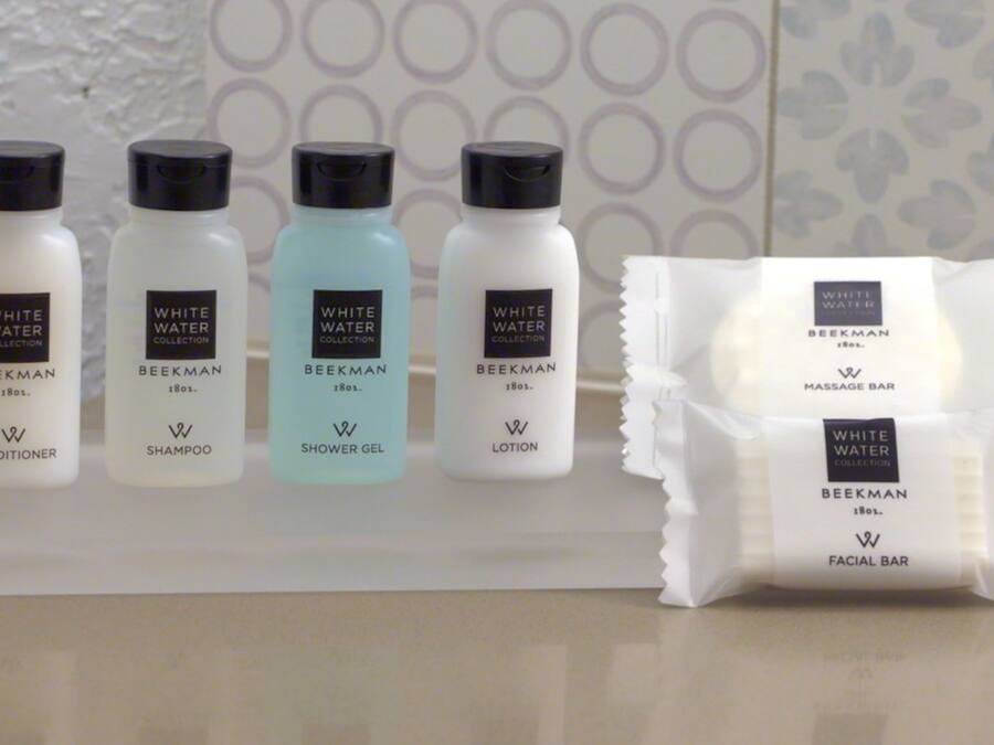 A display of White Water Collection products including conditioner, shampoo, shower gel, and lotion.