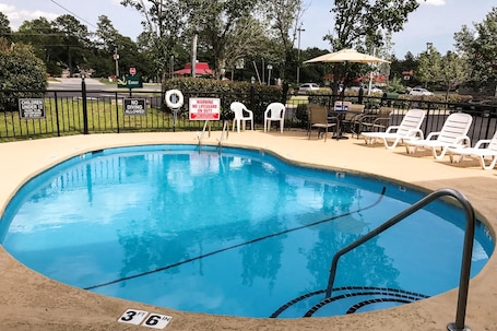 Seasonal outdoor pool, open 9:00 AM to 9:00 PM, pool umbrellas