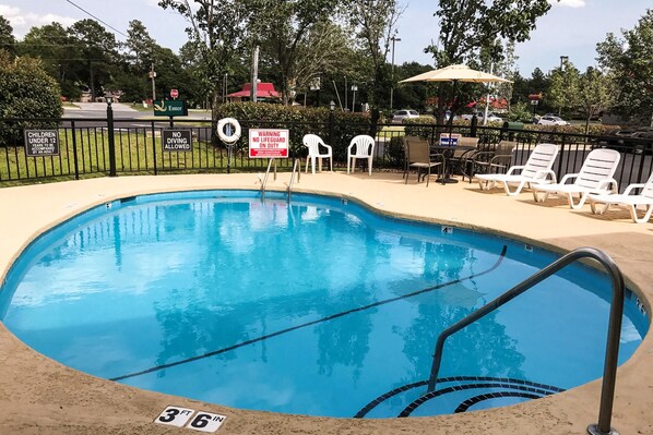 Seasonal outdoor pool, open 9:00 AM to 9:00 PM, pool umbrellas