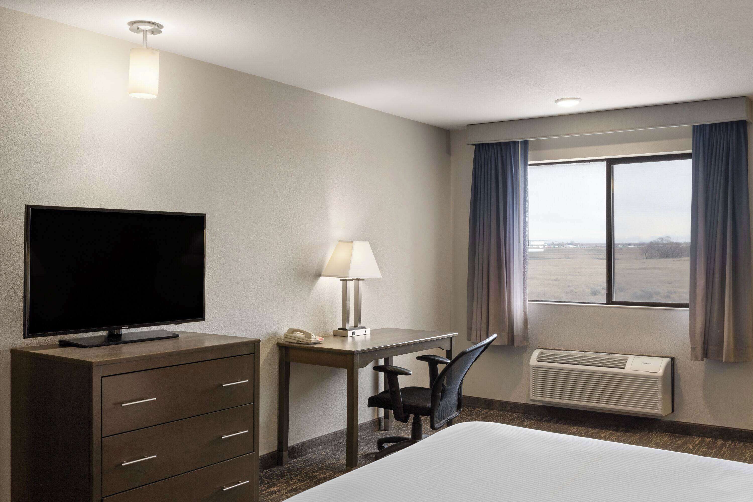 deluxe studio suite, 1 king bed, non smoking | pillow-top beds, individually furnished, desk, laptop workspace