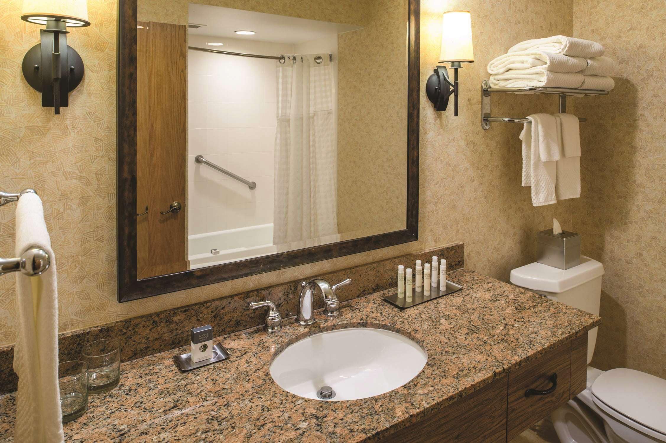 designer toiletries, hair dryer, towels