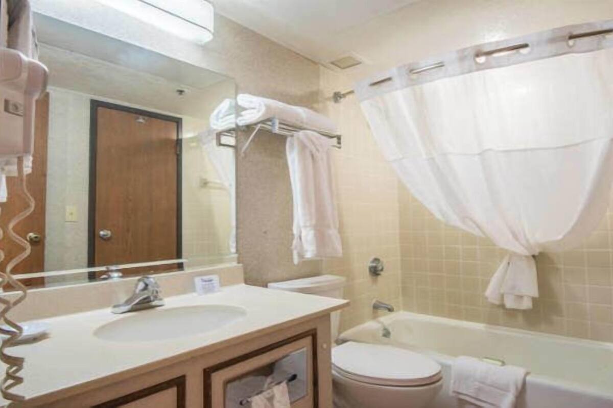 combined shower/bathtub, hair dryer, towels, soap