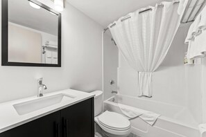 Suite, 1 Bedroom, Non Smoking (1 King Bed) | Bathroom | Combined shower/tub, eco-friendly toiletries, hair dryer, towels
